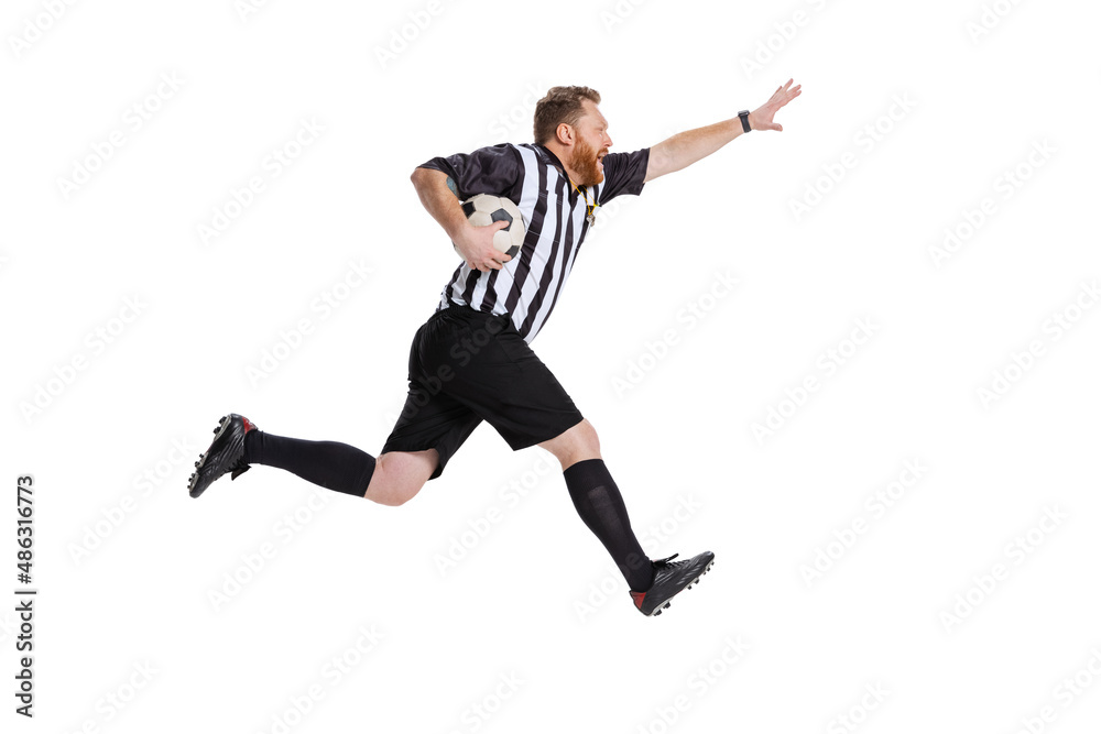 Dynamic portrait of soccer or football referee running with football ball isolated on white studio background. Concept of sport, rules, competitions, rights, ad, sales.