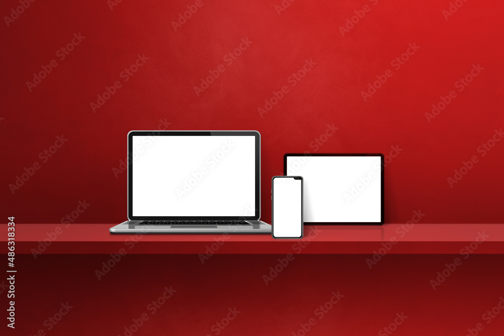 Laptop, mobile phone and digital tablet pc on red wall shelf. Horizontal background Laptop, mobile phone and digital tablet pc on red wall shelf. Horizontal background