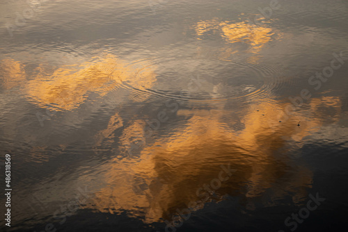 sunset reflected over the lake © Juan