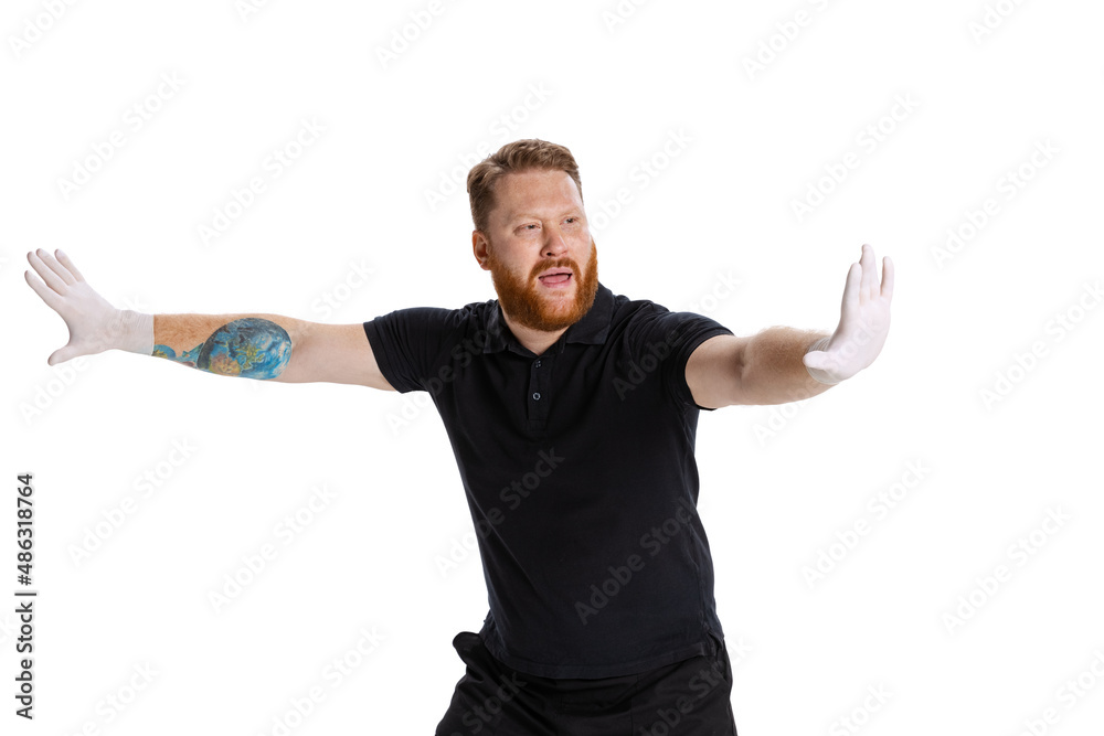 Studio shot of sport referee wearing black t-shirt referees the game isolated on white studio background. Concept of sport, rules, competitions, rights, ad, sales. Studio shot of sport referee wearing black t-shirt referees the game isolated on white studio background. Concept of sport, rules, competitions, rights, ad, sales.