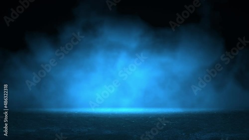 Mysterious smoke in blue light moving over old asphalt. Street with a dark horror atmosphere. Night scene with fog without people. Horror road. Seamless background, animation loop stock video. photo