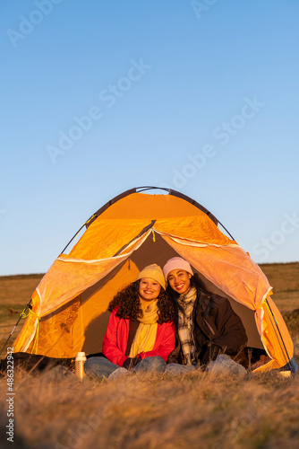 Portrait of female friends camping