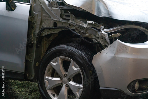 Close-up of the damage to the gray car front right wing and wheel