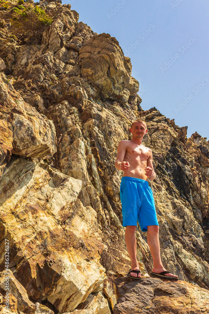 Young traveler hiker with natural coastal landscapes on Kos Greece.