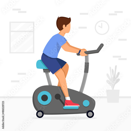 Man training on exercise bike