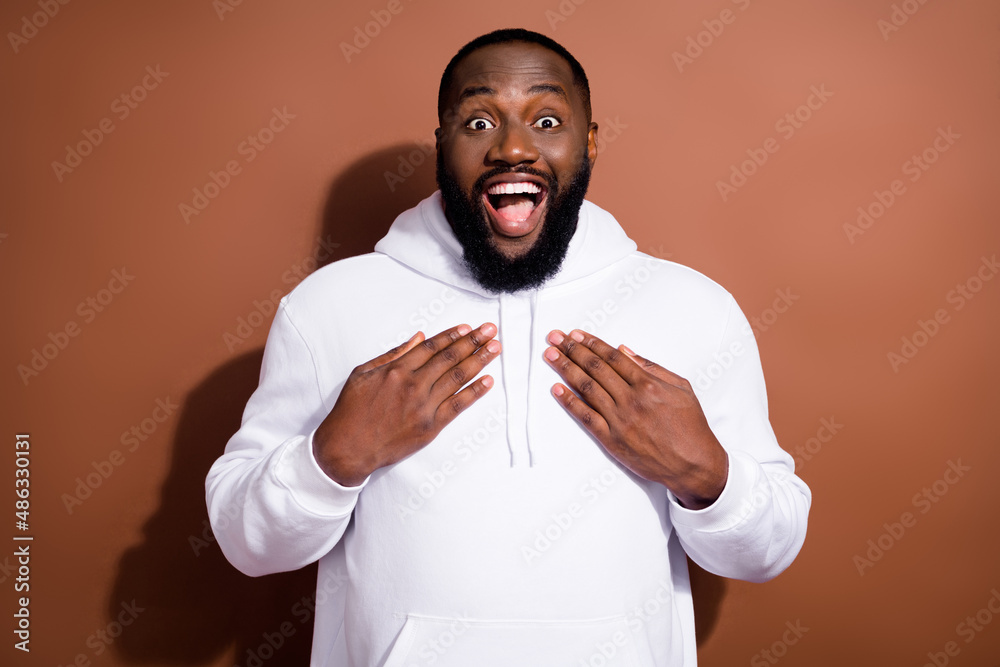 Photo of pretty impressed guy dressed white sweatshirt arms chest open mouth isolated brown color background