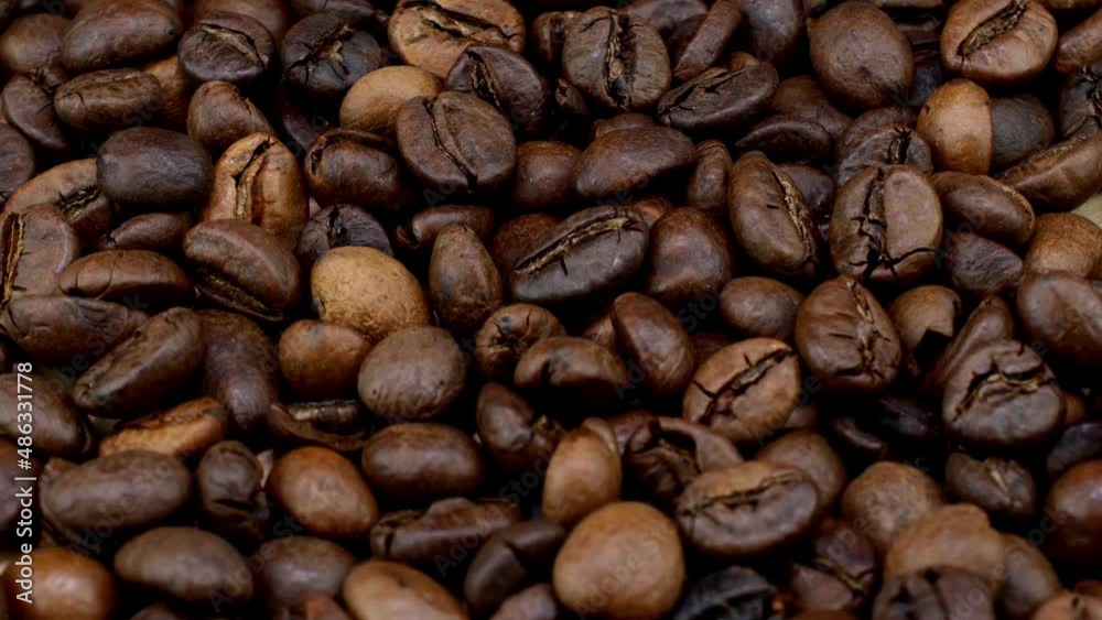 Fragrant roasted dark coffee beans medium roasted coffee beans circular rotation. Fragrant roasted dark coffee beans medium roasted coffee beans circular rotation.