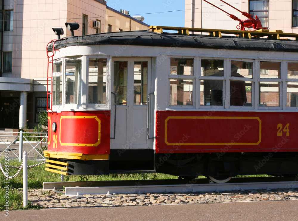 Kazan street in summer, Tatarstan, Russia - July 18 2021v- Retro tram. Place is tourist attraction of Kazan. Girl having fun with old vintage tramway. Transport, people travel and sightseeing concept.