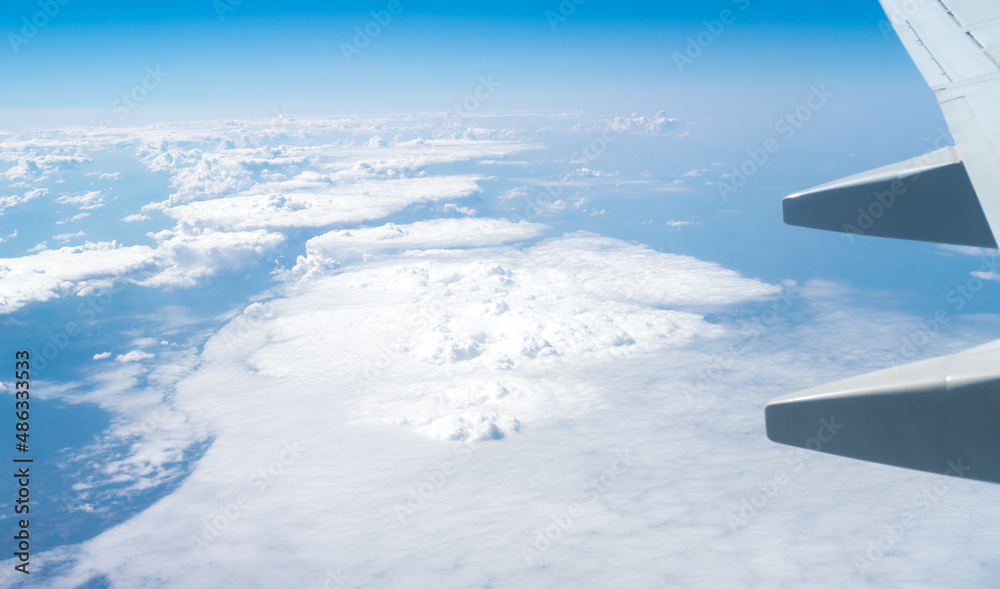Beautiful white clouds and airplane wing. Selective focus. Beautiful white clouds and airplane wing. Selective focus.