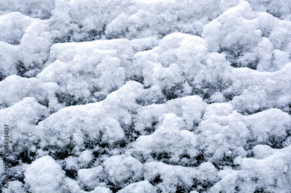 texture of freshly fallen snow on the car glass surface.