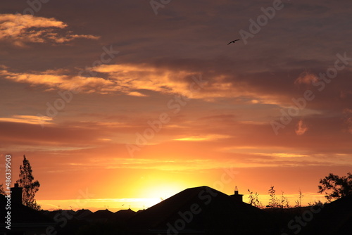 sunrise over a house