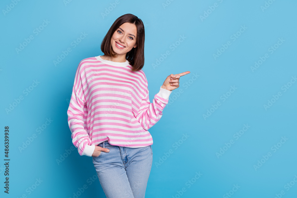 Photo of lovely millennial lady index promo wear shirt jeans isolated on blue background Photo of lovely millennial lady index promo wear shirt jeans isolated on blue background