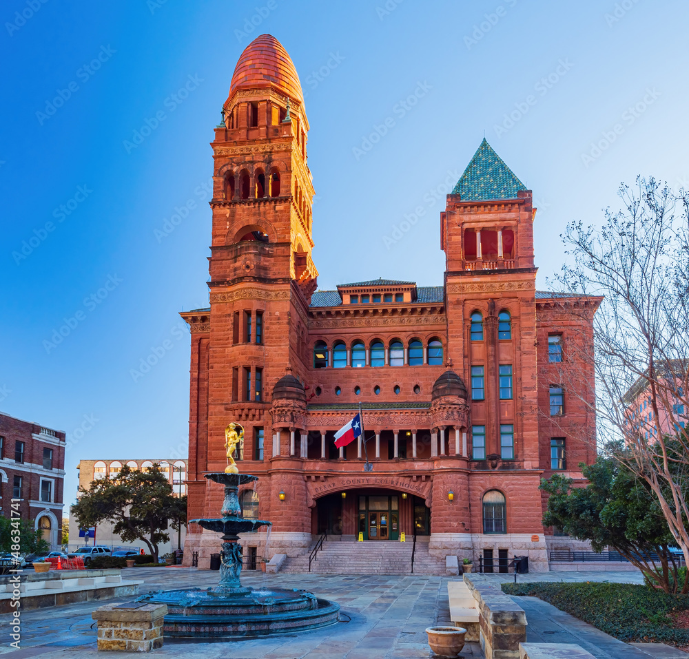 Sunny view of Courthouse building and Lady of Justice statue