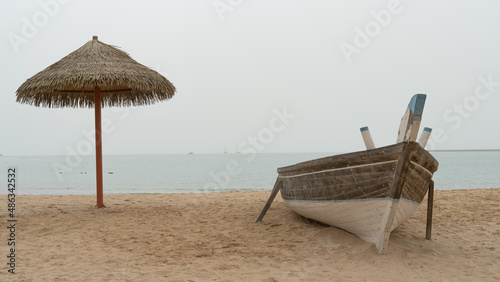 Family beach in the Wakrah souq (Traditional Market) along with traditional boats