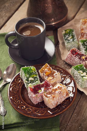 Turkish Delight. view of the tol with a cup of coffee and Turkish delight sweets on a plate. A traditional oriental treat is sweetness. photo