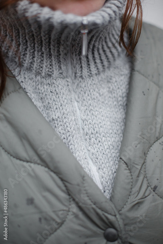 Homemade knitted alpaca collar. Warm wool sweater in natural wool
