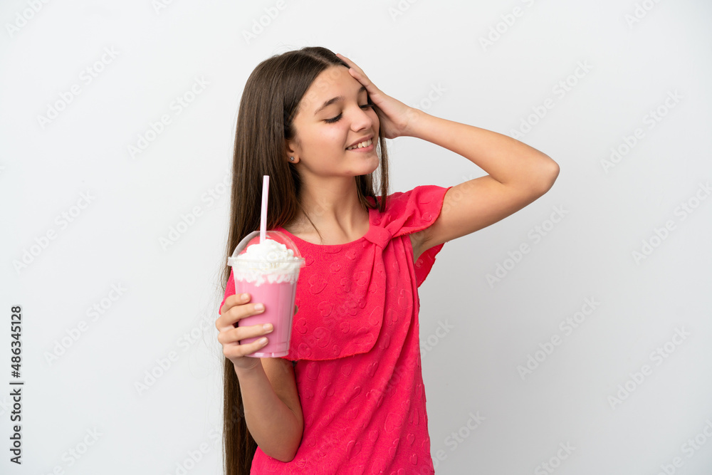 Little girl with strawberry milkshake over isolated white background smiling a lot Little girl with strawberry milkshake over isolated white background smiling a lot