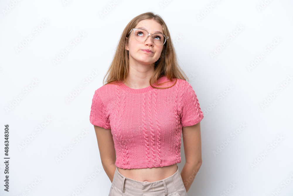 Fototapeta premium Teenager Russian girl isolated on white background and looking up