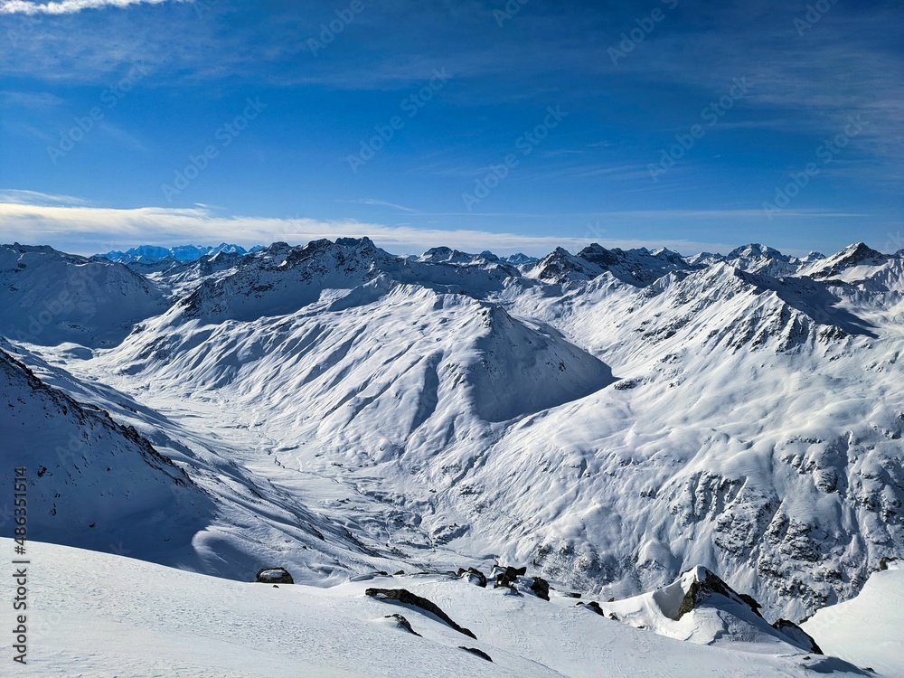 Skitour on the sentisch horn. Mountaineering in a wonderful mountain world in davos switzerland. snowy mountain peaks
