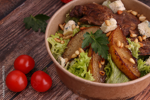 Quadro su tela salad with pear and dor blue cheese on wooden background for menu