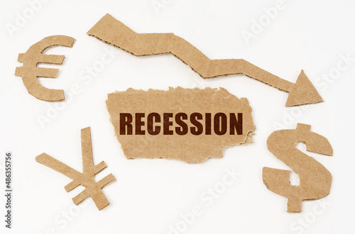 On a white background, currency symbols, an arrow and a cardboard box with the inscription - recession
