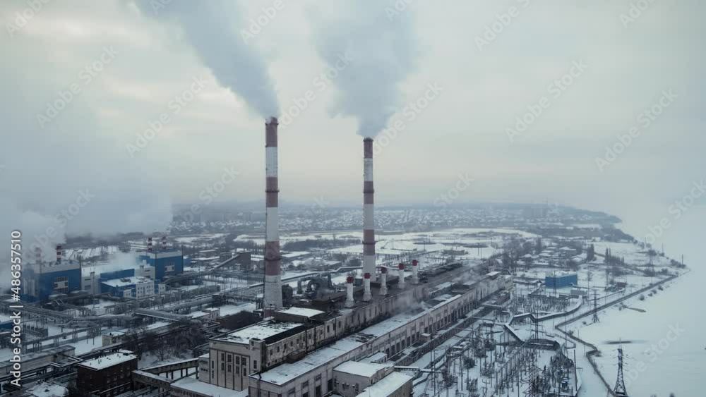 Factory smokestack emissions, climate change and global warming for the environment concept. Aerial view Factory smokestack emissions, climate change and global warming for the environment concept. Aerial view