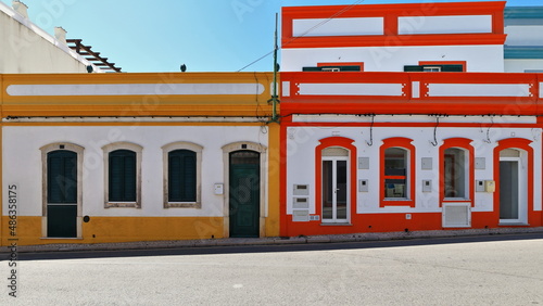 White and yellow-red-blue painted Neoclassical townhouses-Rua Porta Nova Street. Tavira-Portugal-095