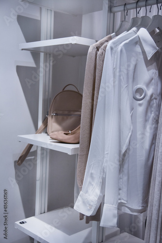 hanging clothes in the closet on a hanger. Clothing Retail concept