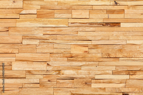 Beautiful horizontal mosaic of split wooden planks of longitudinal texture, closeup.