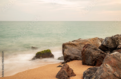 Rocks on the beach at sunset © Fredy Ferreri