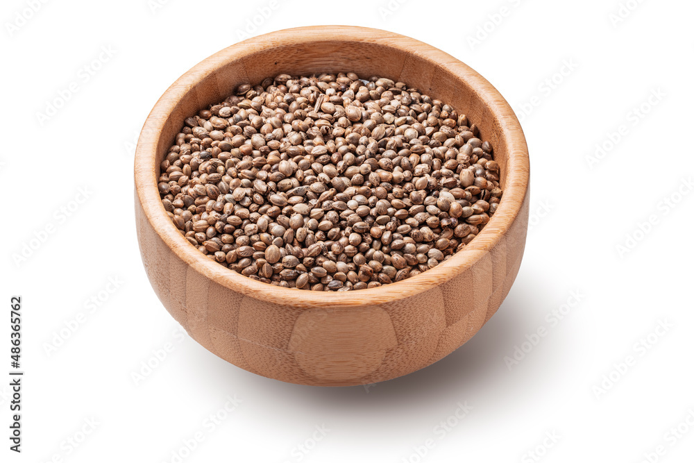 Cannabis Hemp seed in wooden bowl isolated on white background. Cannabis Hemp seed in wooden bowl isolated on white background.