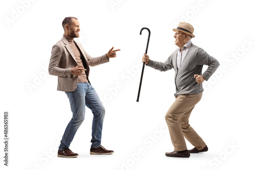 Young man and a elderly man dancing