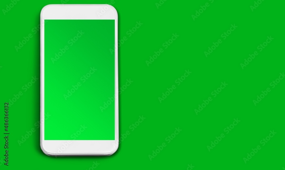 New modern smartphone with a blank screen on green background