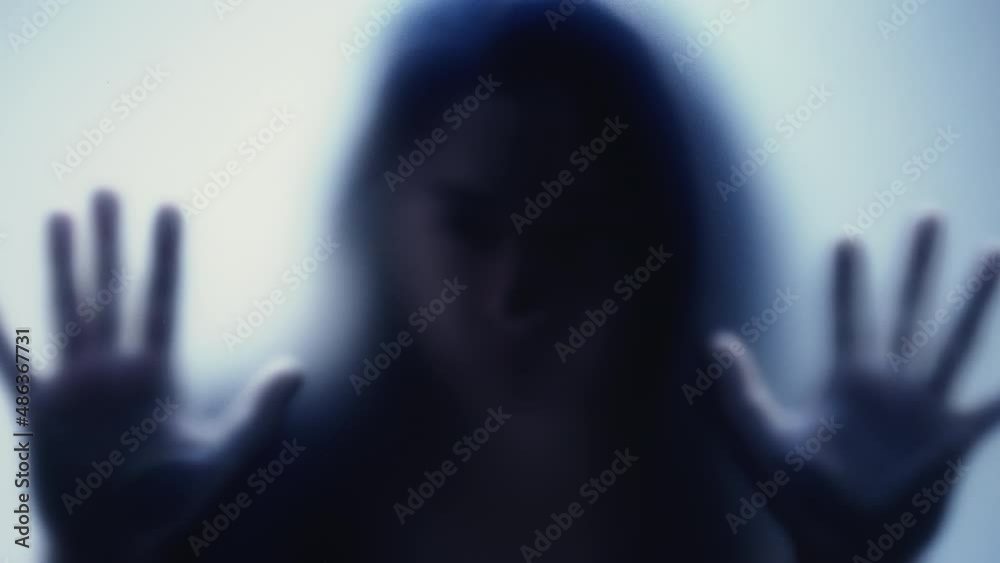 Depressed woman stuck behind glass seeking help and support depression concept