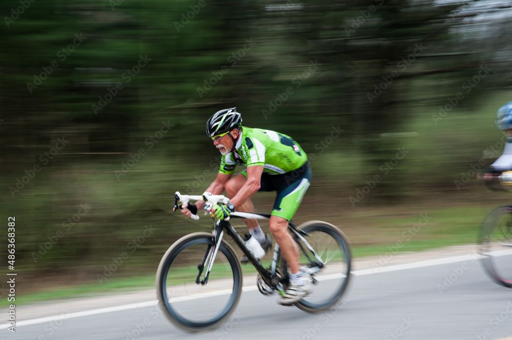 Naklejka premium Man in road biking race