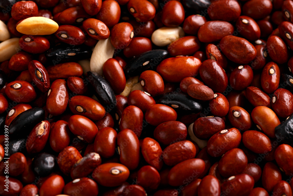Dried red beans and black, white mix on rustic table Dried red beans and black, white mix on rustic table