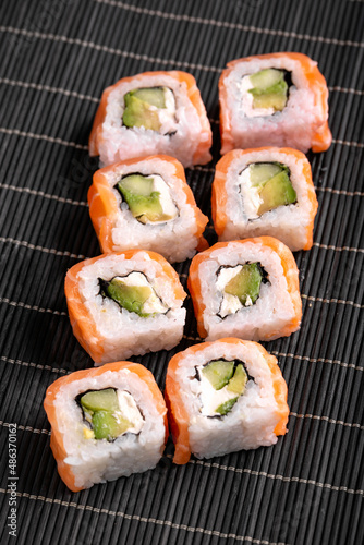 Sushi Rolls Philadelphia with salmon, avocado, soft cheese