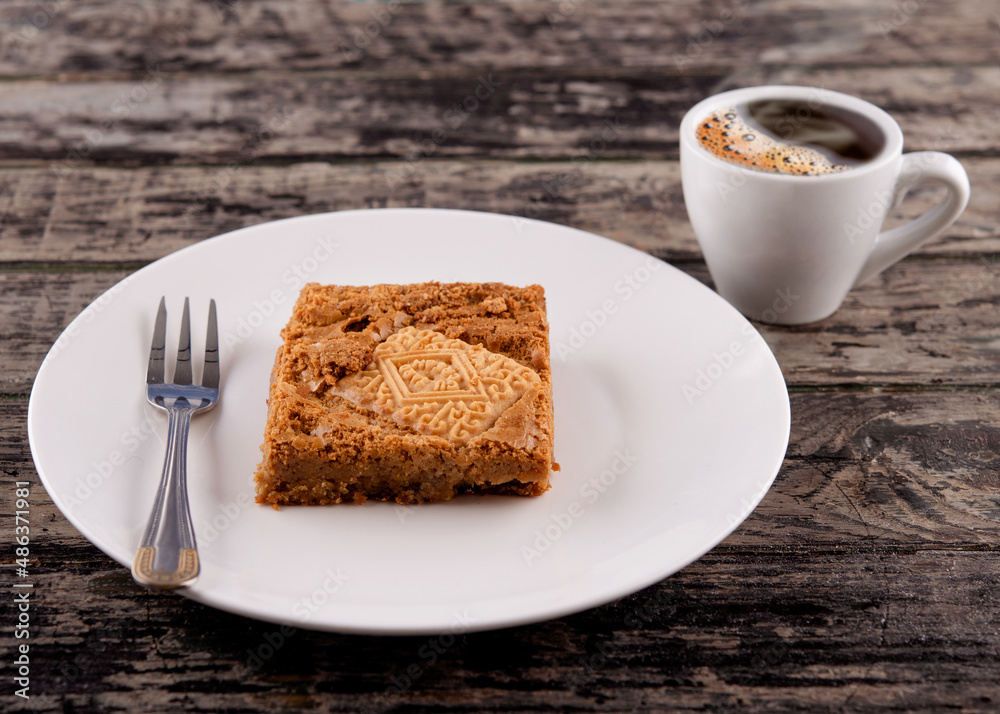 cup of coffee with cake on white plate on wooden table in cafe cup of coffee with cake on white plate on wooden table in cafe