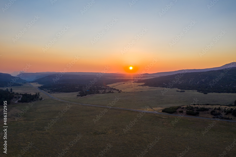 Fototapeta premium Aerial sunset view with mountains