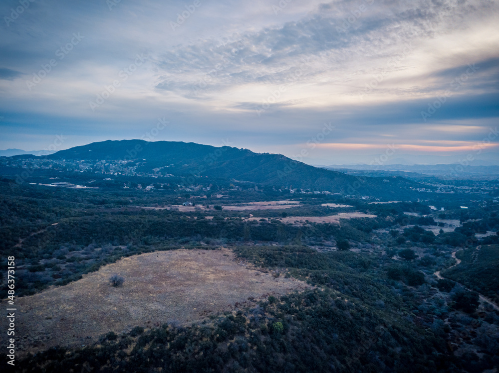 Aerial sunset view with mountains Aerial sunset view with mountains