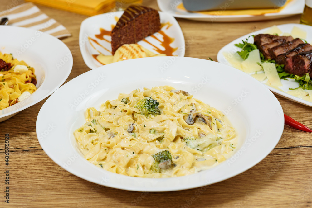 Hot dishes with pasta, cheese, vegetables and meat Hot dishes with pasta, cheese, vegetables and meat