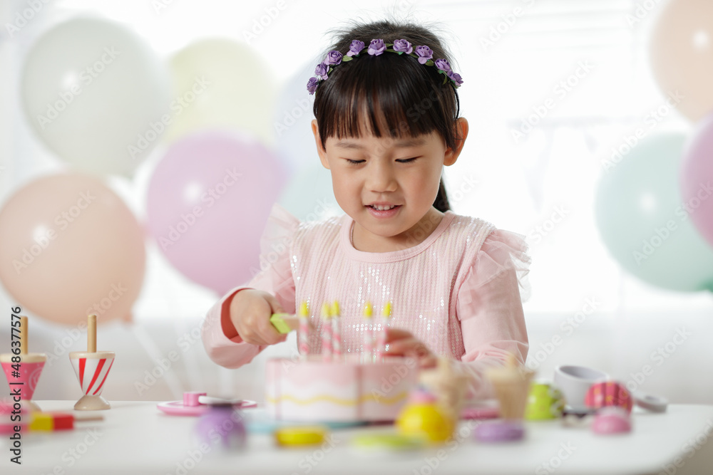 young girl pretend playing food preparing at home