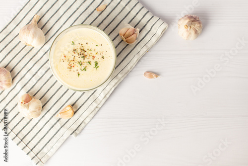 garlic sauce on a white table. Universal garlic sauce