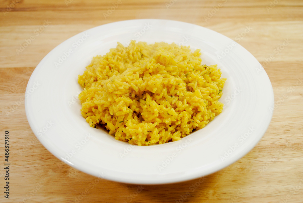 Side Dish of Steaming Herb and Yellow Rice Side Dish of Steaming Herb and Yellow Rice