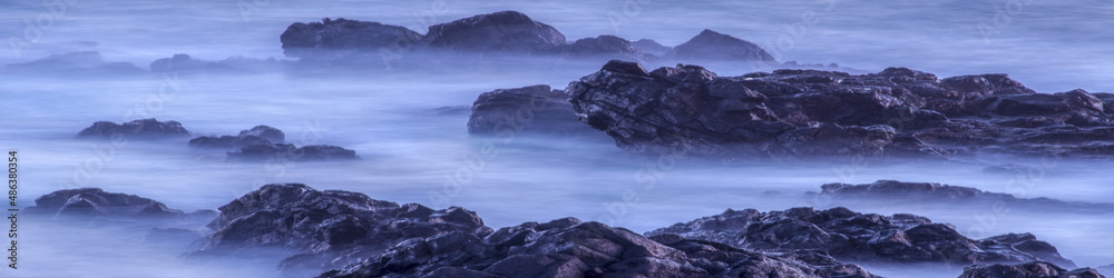 Water with rock nature photo with long exposure fog effect abstract color ocean background Panorama banner
