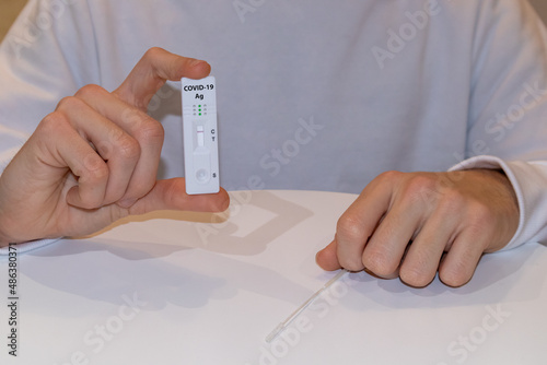 Person holding a negative COVID rapid test photo