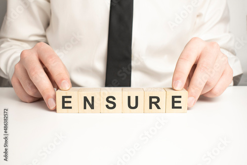 ENSURE word made with building blocks, concept.