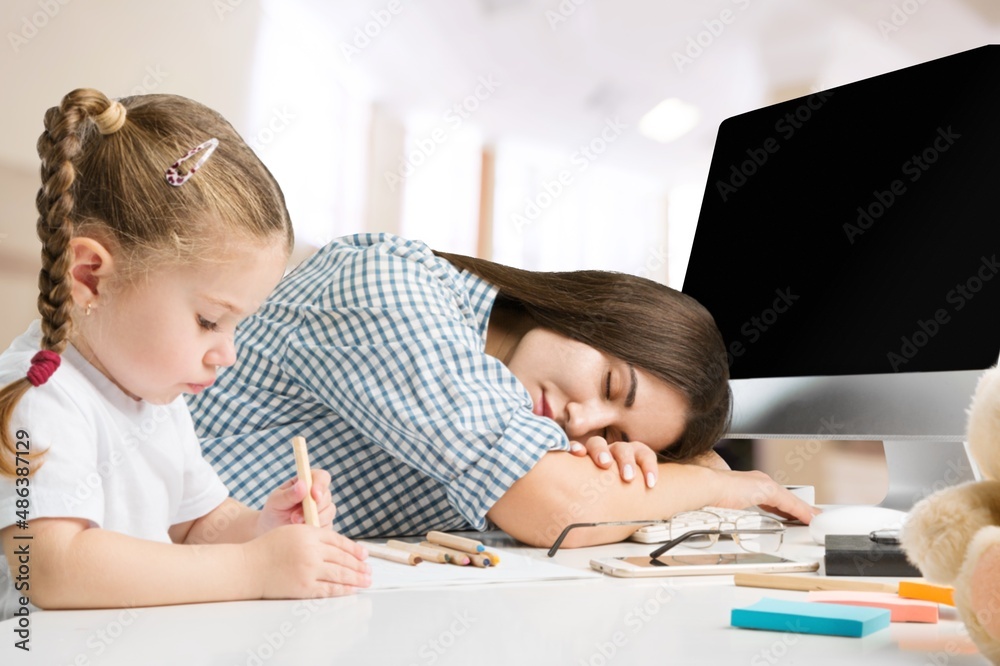 Tired young freelance mom working from home, watching little kid. Naughty kid distracting mum from distance work Tired young freelance mom working from home, watching little kid. Naughty kid distracting mum from distance work