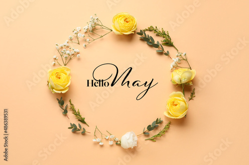 Beautiful flowers with text HELLO MAY on beige background © Pixel-Shot