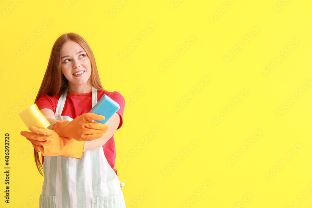 Young woman with sponges on color background Young woman with sponges on color background